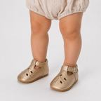 Chaussures premiers pas bébé fille dorées à bride en T