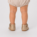 Chaussures premiers pas bébé fille dorées à bride en T