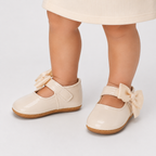 Chaussures premiers pas bébé fille crème à nœud en cuir PU