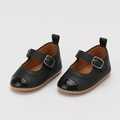 Chaussures premiers pas bébé fille noires en PU à bride boucle
