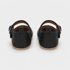 Chaussures premiers pas bébé fille noires en PU à bride boucle