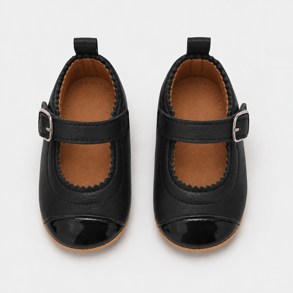 Chaussures premiers pas bébé fille noires en PU à bride boucle