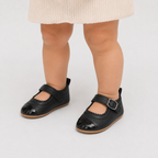 Chaussures premiers pas bébé fille noires en PU à bride boucle