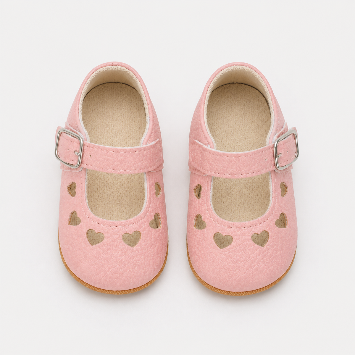 Chaussures premiers pas bébé fille roses en PU à découpes cœur