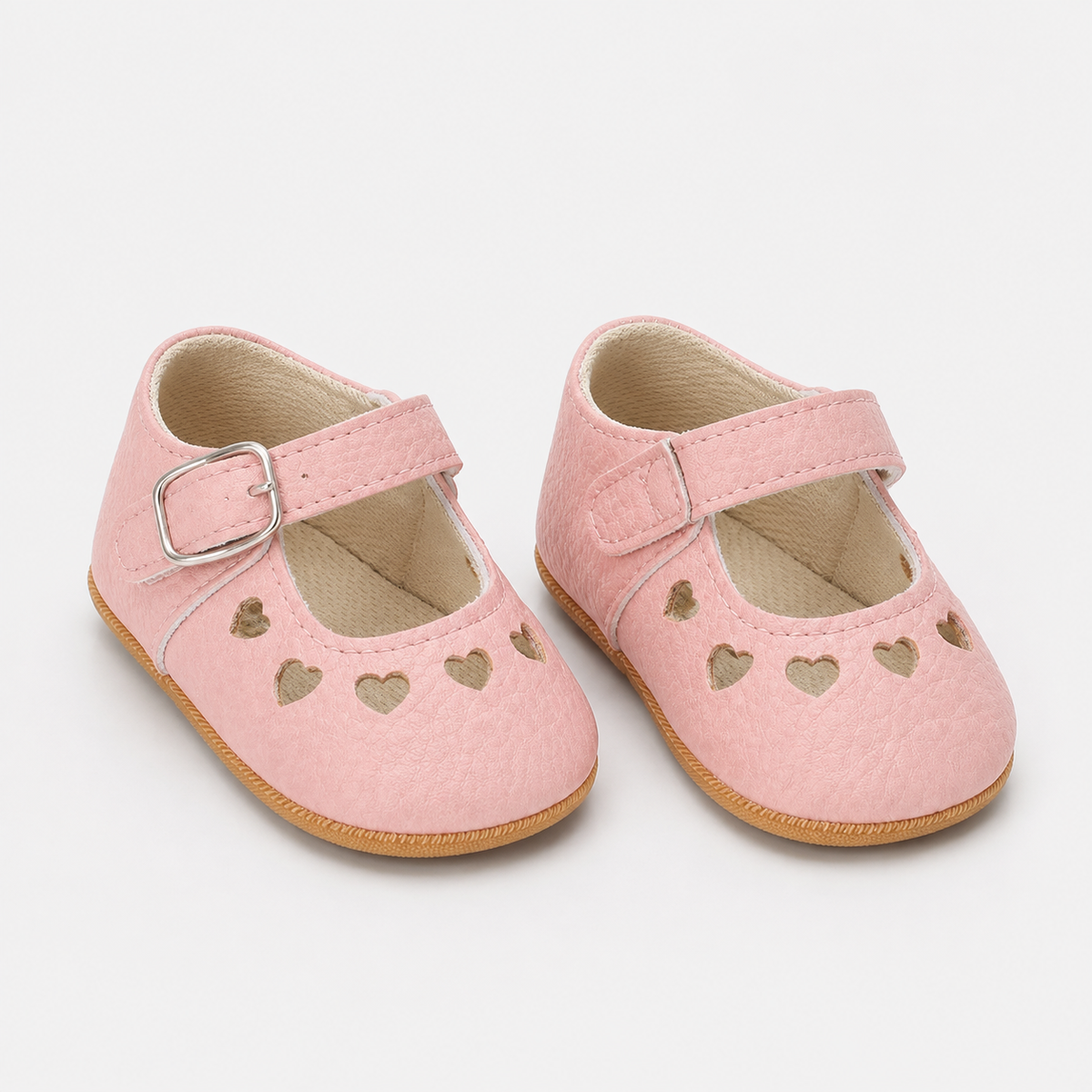 Chaussures premiers pas bébé fille roses en PU à découpes cœur
