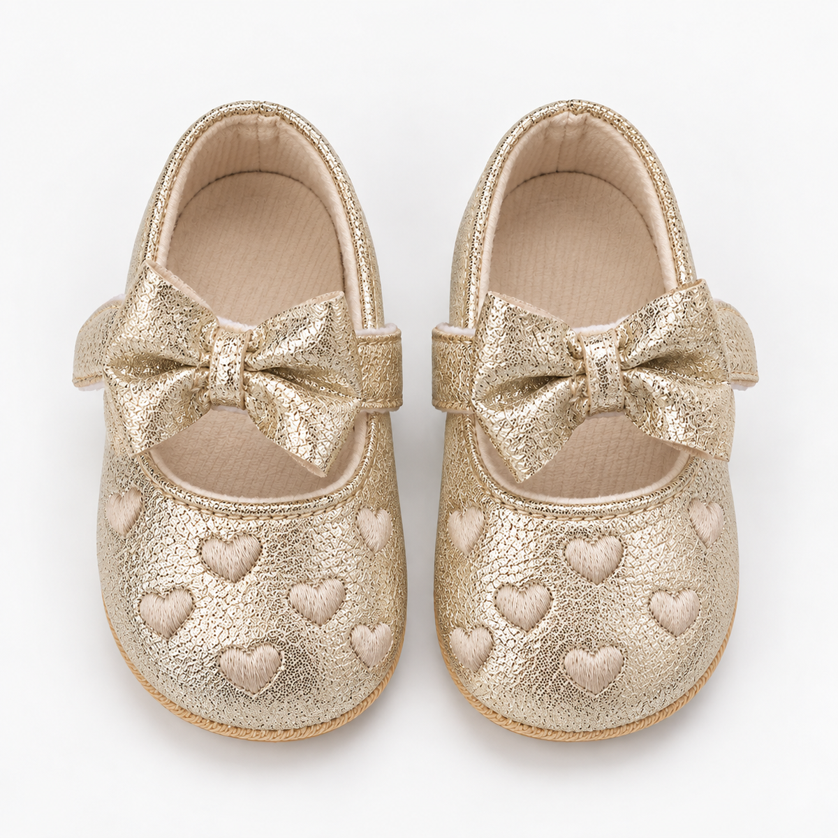 Chaussures premiers pas bébé fille dorées à nœud et cœurs brodés