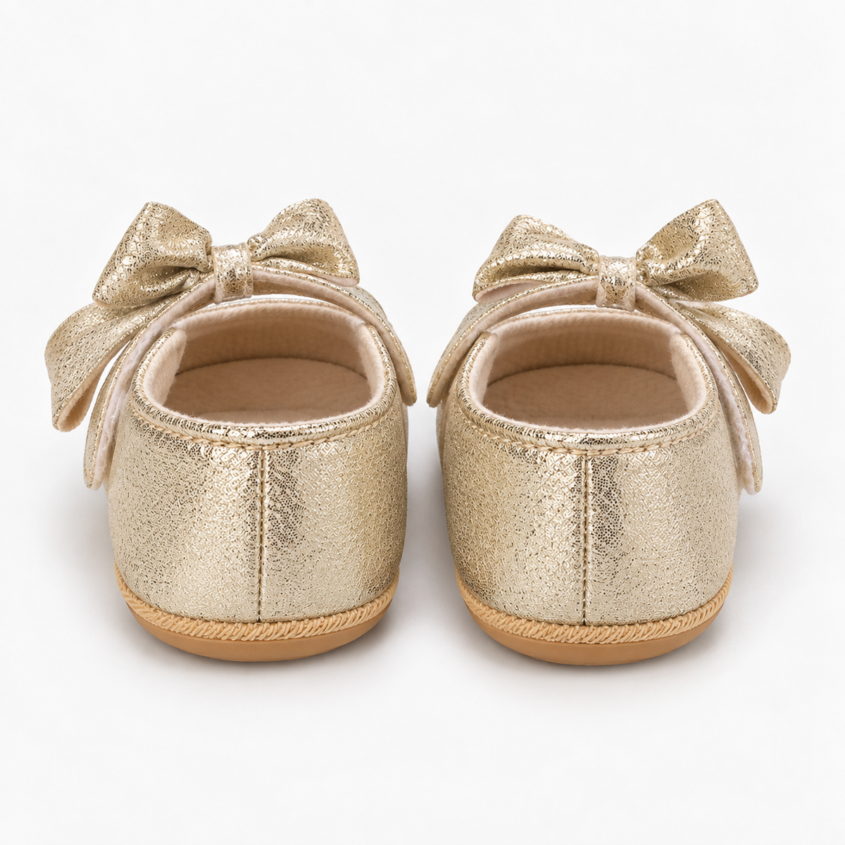 Chaussures premiers pas bébé fille dorées à nœud et cœurs brodés