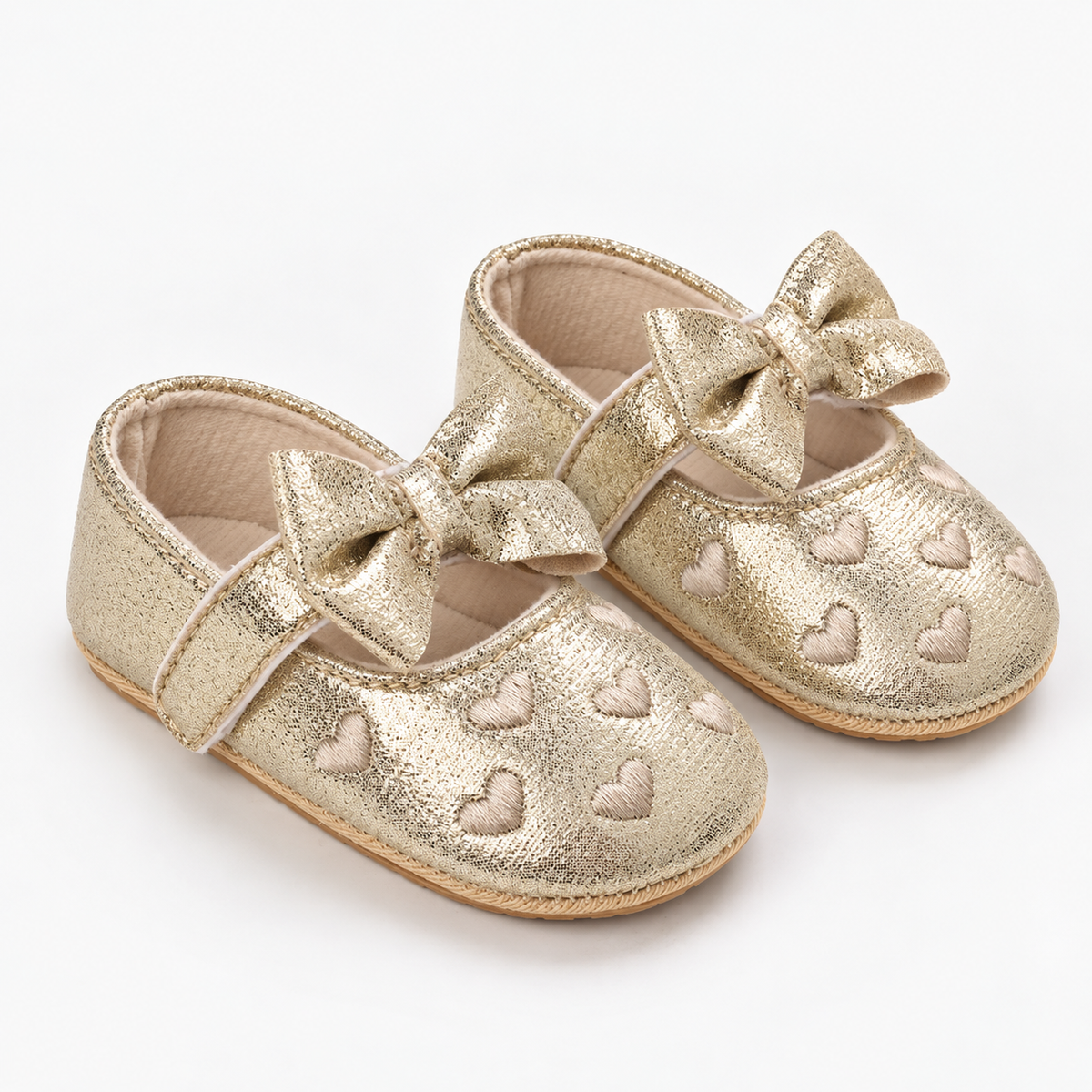 Chaussures premiers pas bébé fille dorées à nœud et cœurs brodés