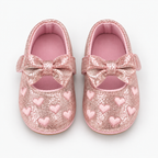Chaussures de premier pas bébé fille rose pailleté à cœurs avec nœud