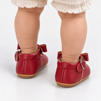Chaussures premiers pas bébé fille rouges à nœud festonné