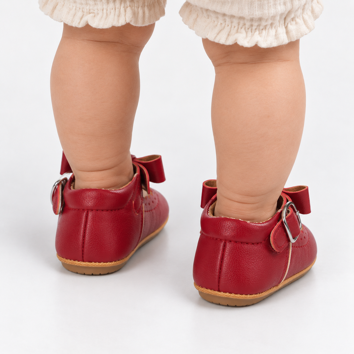 Chaussures premiers pas bébé fille rouges à nœud festonné