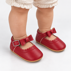 Chaussures premiers pas bébé fille rouges à nœud festonné