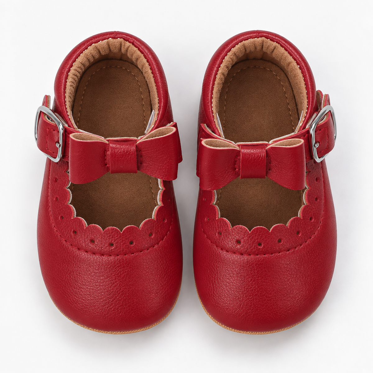 Chaussures premiers pas bébé fille rouges à nœud festonné