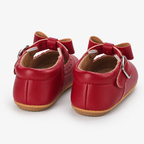 Chaussures premiers pas bébé fille rouges à nœud festonné